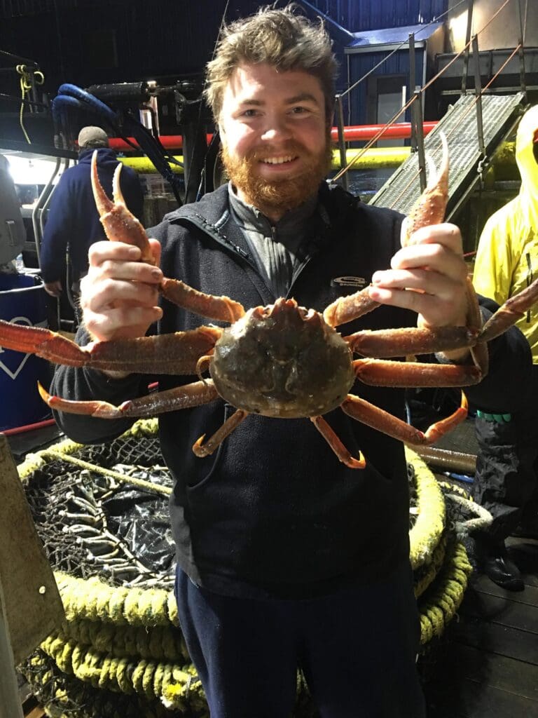 Monika's son is pictured here holding a giant crab.